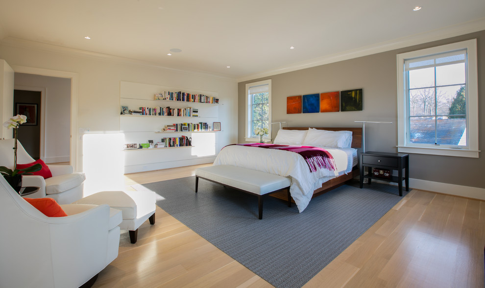 Large minimalist master light wood floor bedroom photo in DC Metro with white walls
