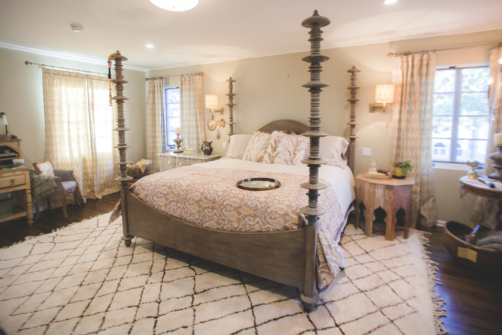 Design ideas for a mediterranean master bedroom in Los Angeles with dark hardwood flooring.