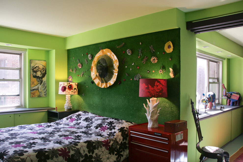Example of an eclectic bedroom design in New York with green walls