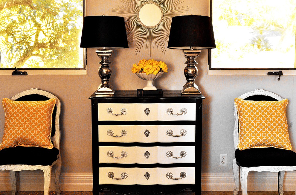 This is an example of a traditional grey and silver bedroom in San Diego with feature lighting.