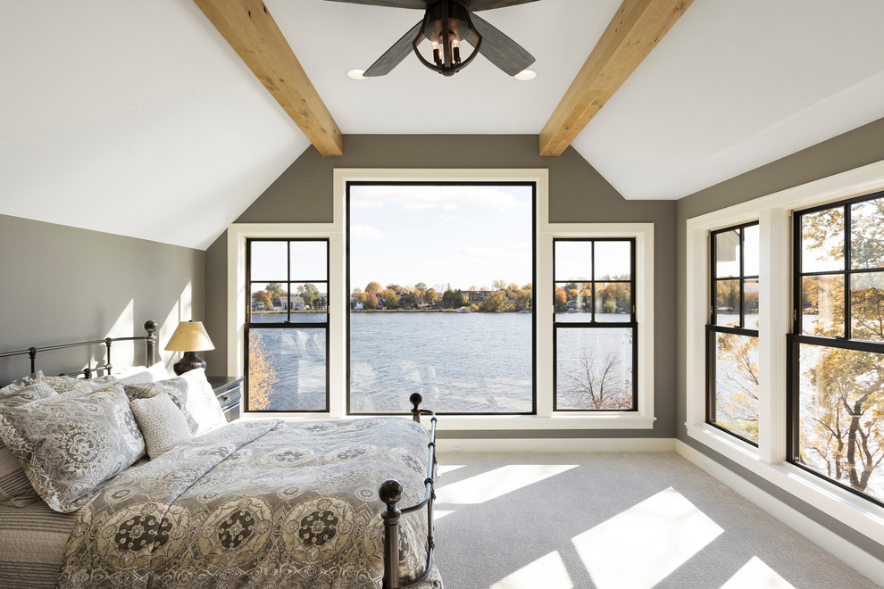 Beach style bedroom in Minneapolis with feature lighting.