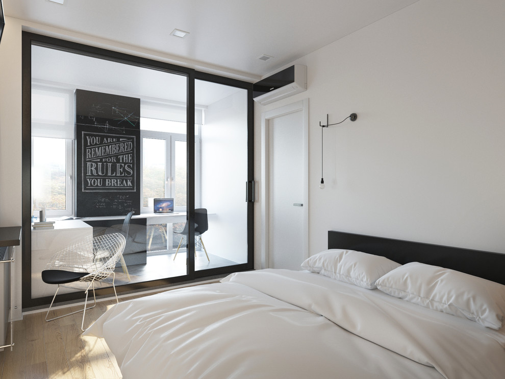 Imagen de dormitorio moderno pequeño con paredes blancas y suelo de madera en tonos medios