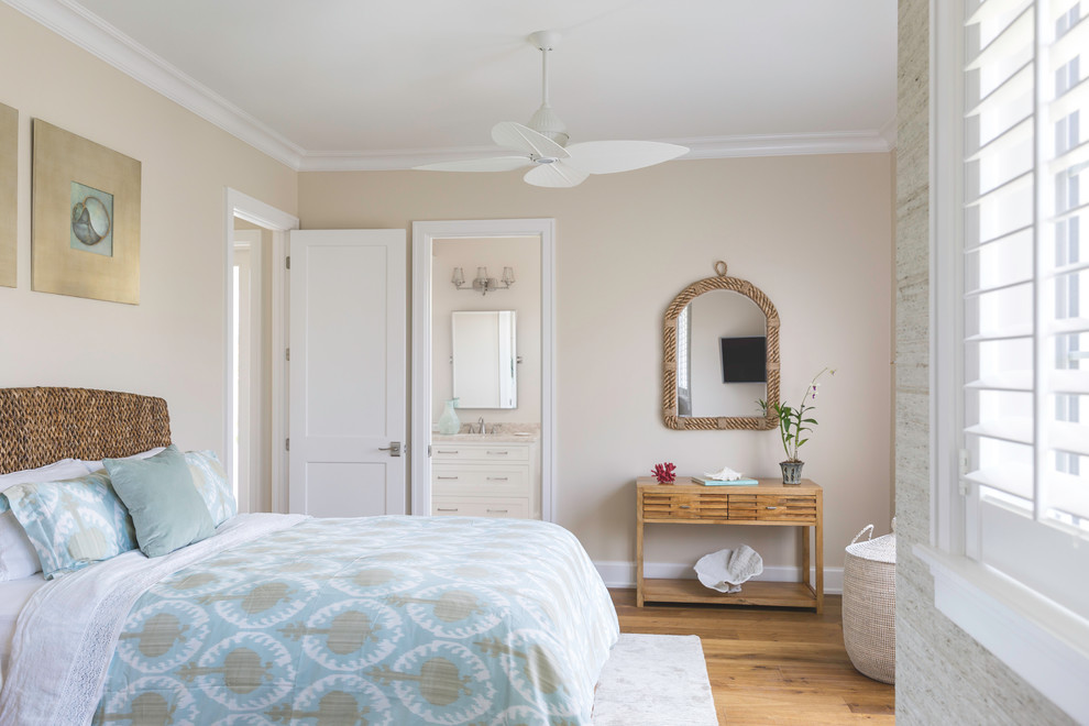 Mid-sized island style guest medium tone wood floor and brown floor bedroom photo in Miami with multicolored walls and no fireplace