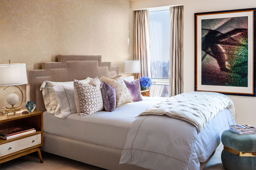 This is an example of a medium sized contemporary master bedroom in New York with beige walls.