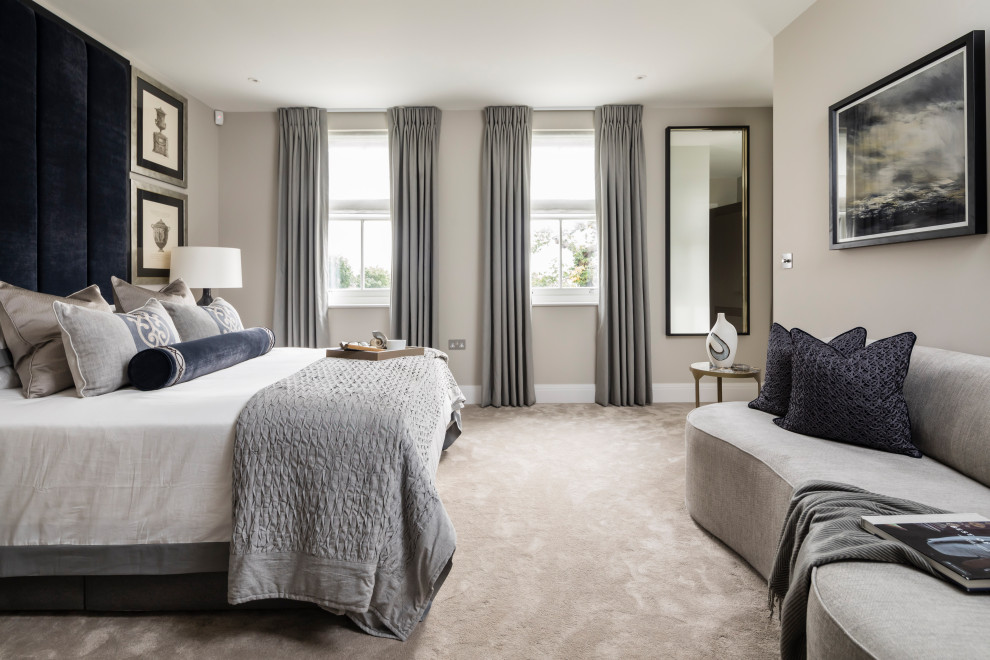 Inspiration for a large contemporary master carpeted and beige floor bedroom remodel in London with gray walls