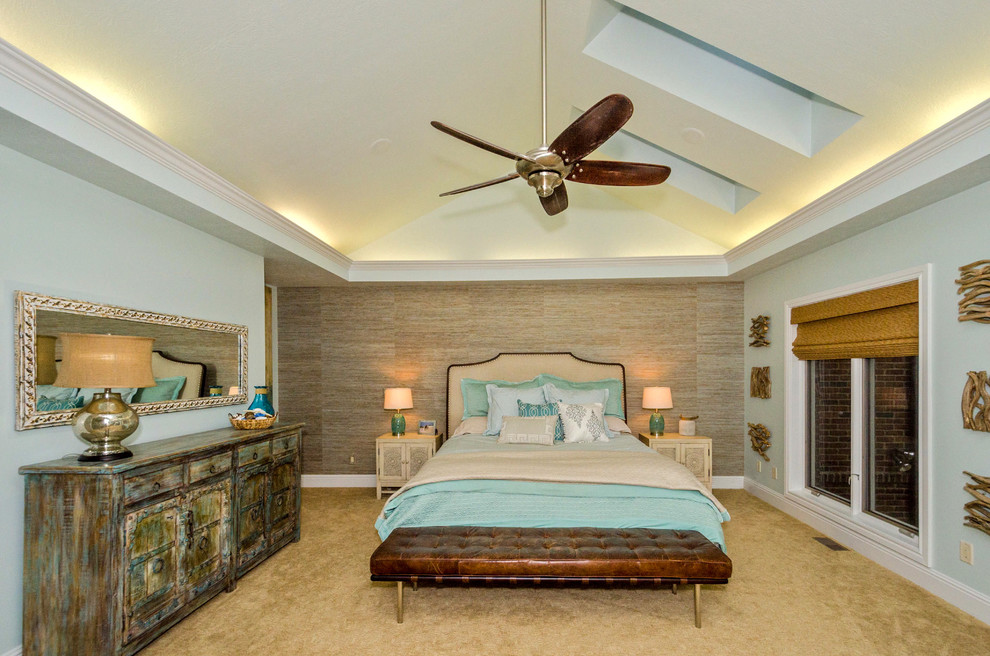 Large eclectic master carpeted bedroom photo in Cincinnati with blue walls, a ribbon fireplace and a stone fireplace