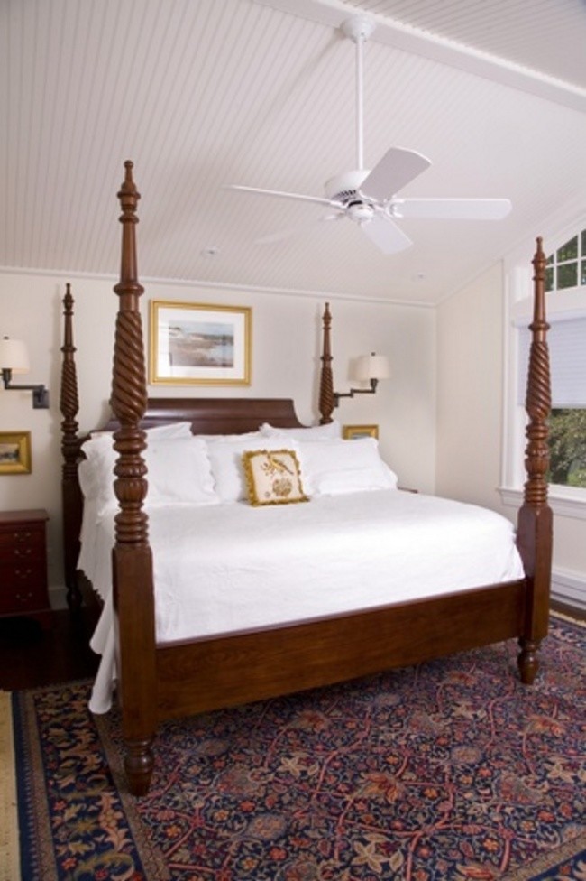 Photo of a medium sized classic guest bedroom in Seattle with beige walls, dark hardwood flooring and no fireplace.