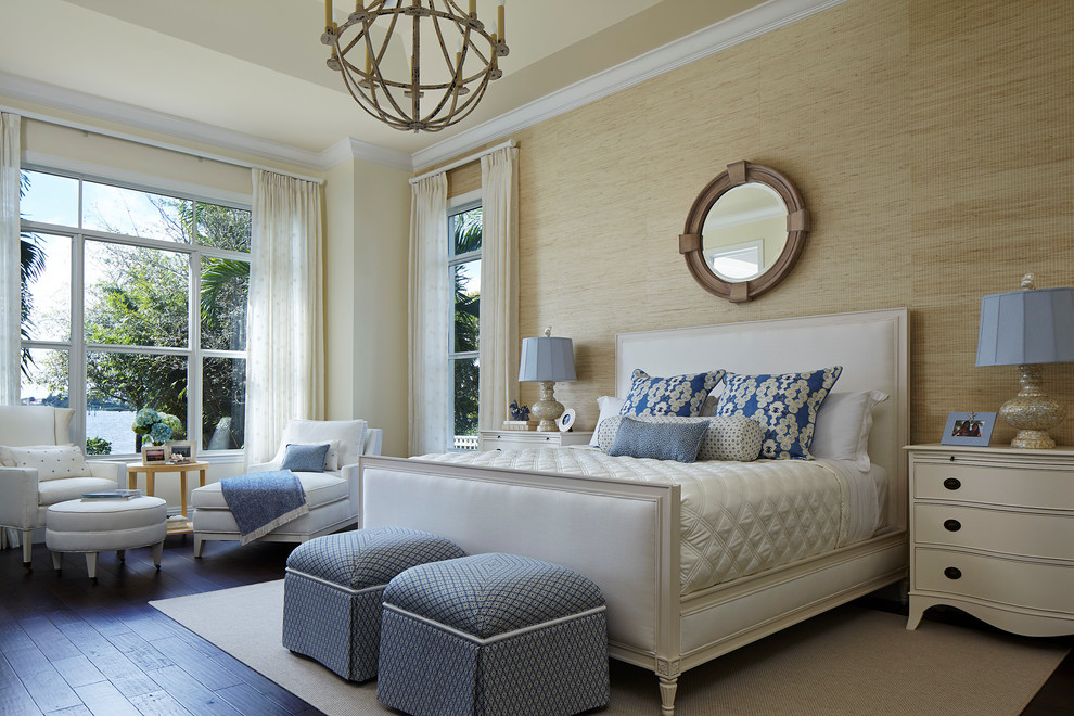 Large beach style master dark wood floor and brown floor bedroom photo in Miami with beige walls and no fireplace