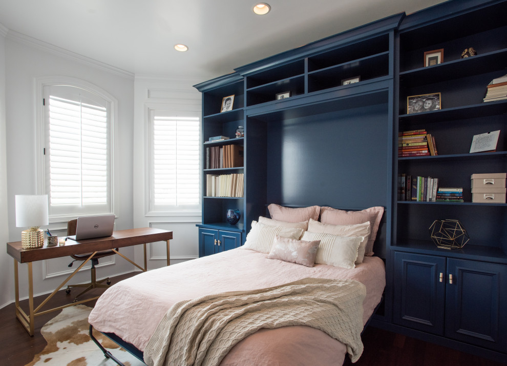 Inspiration for a mid-sized transitional laminate floor and brown floor bedroom remodel in Denver