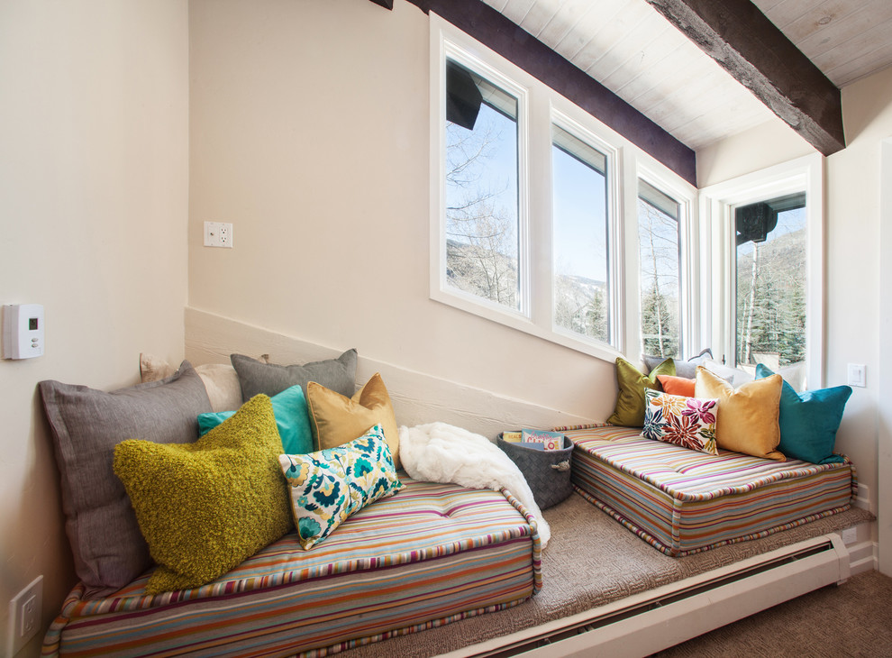 Contemporary bedroom in Denver with beige walls.