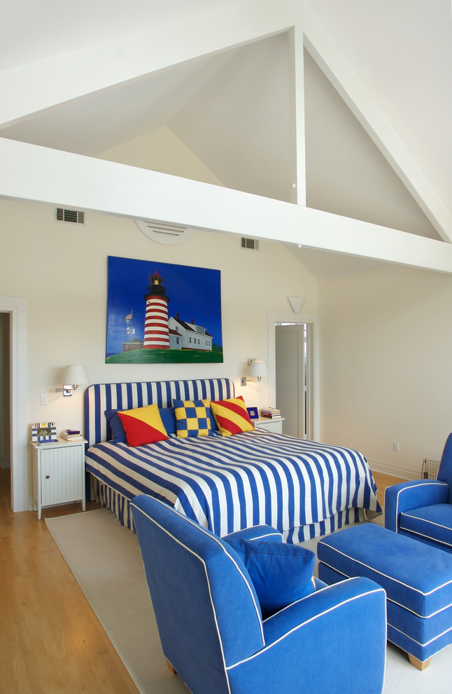 Bedroom - mid-sized coastal master light wood floor bedroom idea in Other with white walls and no fireplace