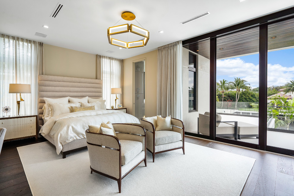 Bedroom - large contemporary master brown floor and dark wood floor bedroom idea in Miami with beige walls