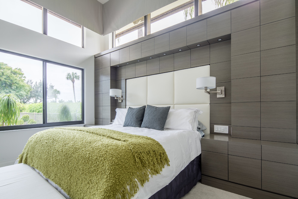 Design ideas for an expansive contemporary master bedroom in Miami with grey walls and carpet.