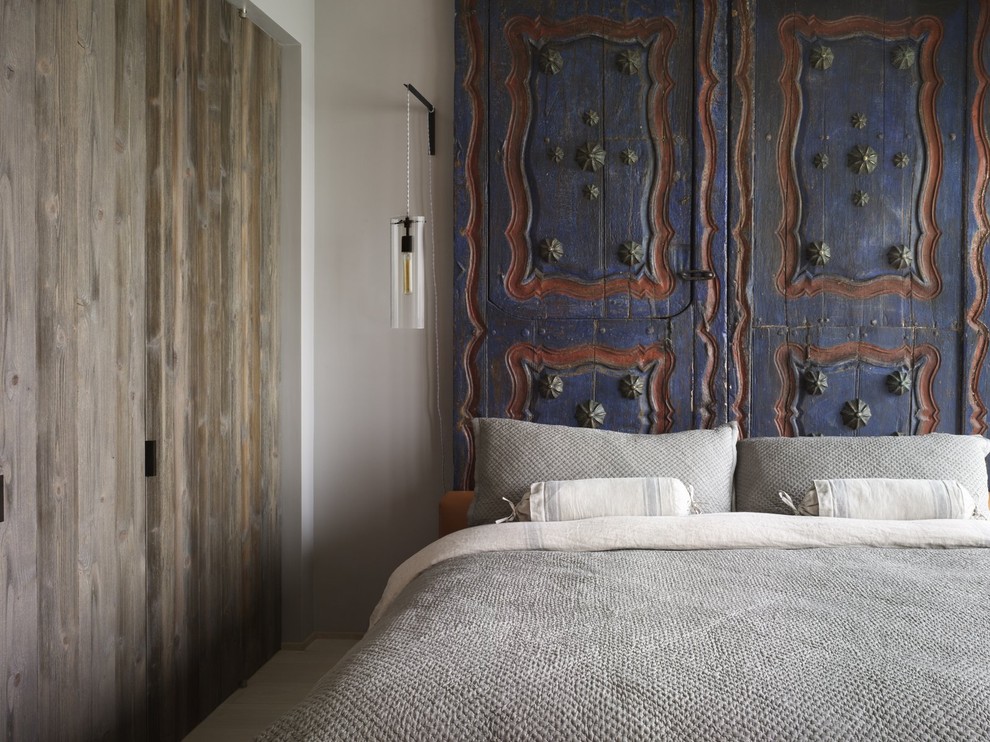 Eclectic bedroom photo in New York with gray walls