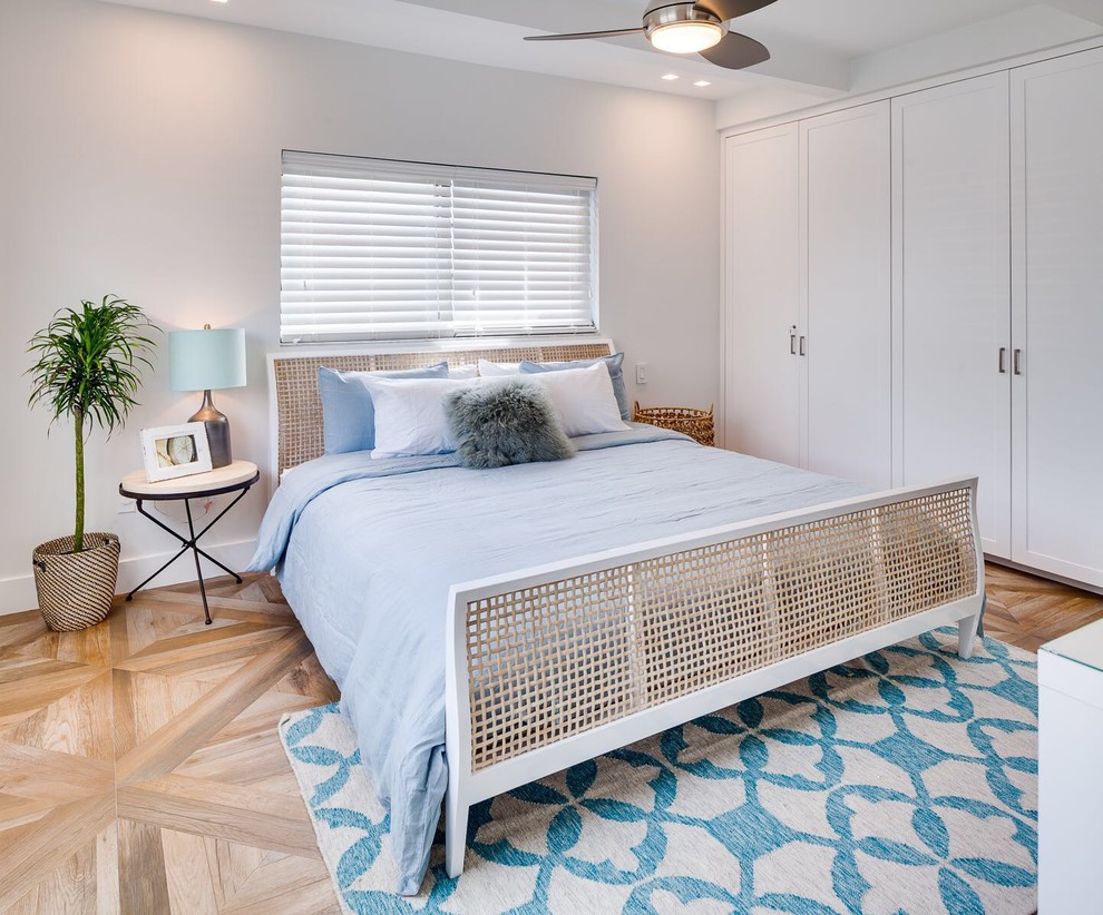 Photo of a medium sized scandi master bedroom in Miami with white walls and ceramic flooring.