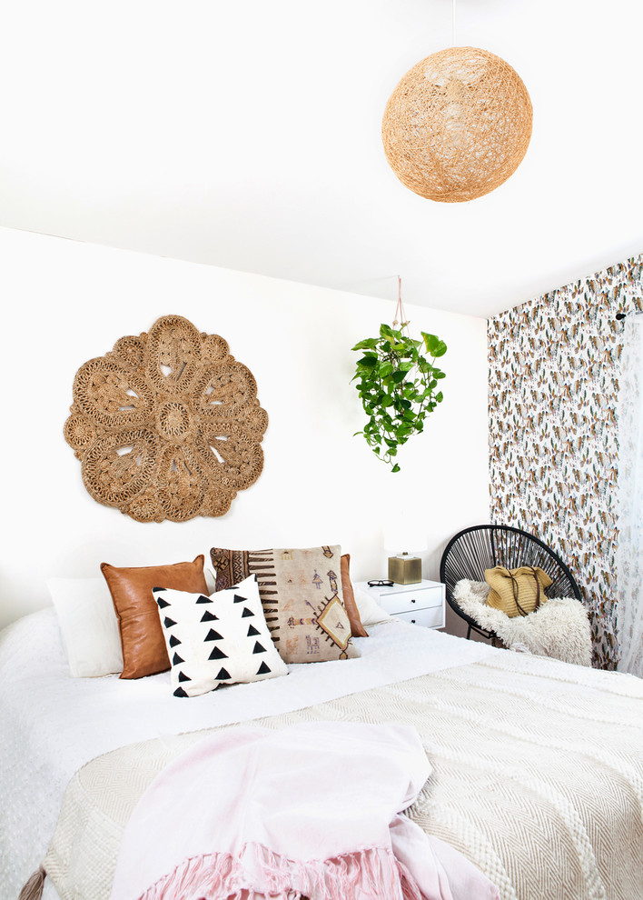 Inspiration for a contemporary bedroom in Toronto with white walls and a feature wall.
