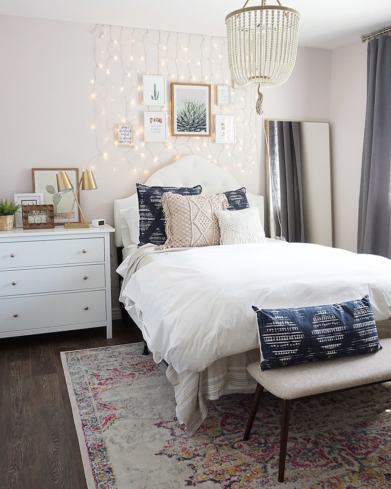 Inspiration for a mid-sized eclectic guest vinyl floor and brown floor bedroom remodel in Phoenix with pink walls