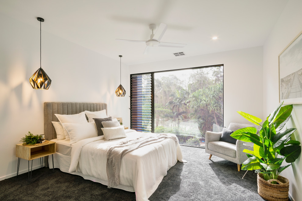Ejemplo de habitación de invitados contemporánea sin chimenea con paredes blancas, moqueta y suelo gris