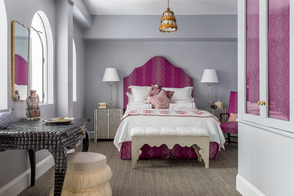 Photo of a contemporary grey and pink bedroom in New York with grey walls.