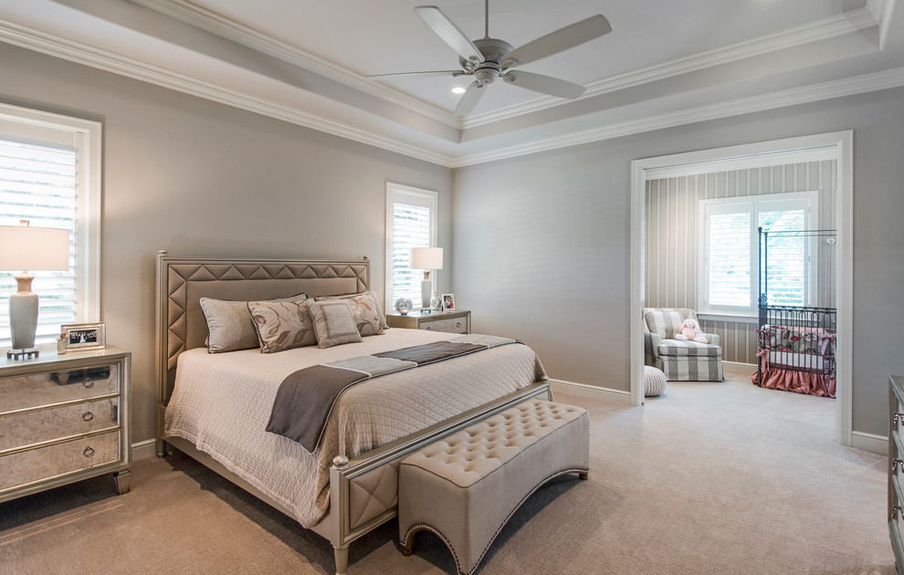 Example of a mid-sized transitional guest carpeted bedroom design in Miami with beige walls and no fireplace