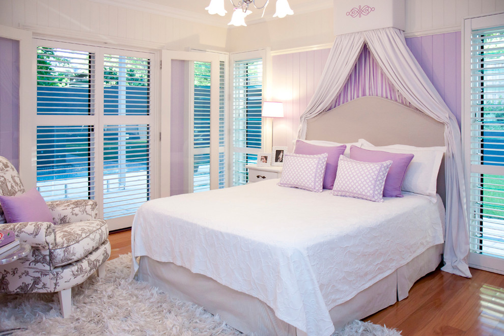 Design ideas for a medium sized classic bedroom in Brisbane with pink walls, light hardwood flooring and no fireplace.