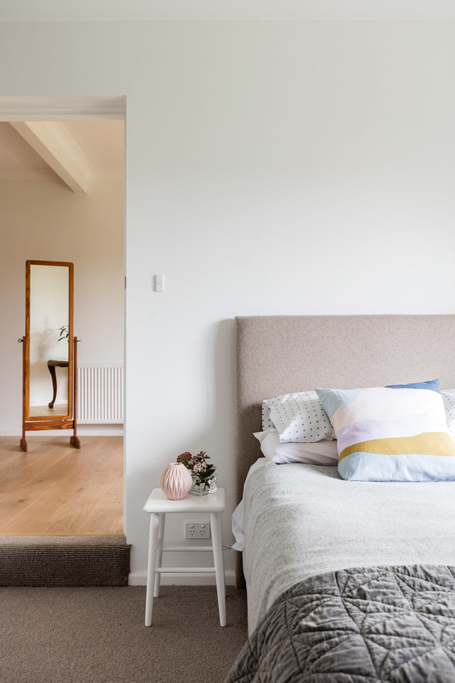 Contemporary guest and grey and pink bedroom in Newcastle - Maitland with white walls and carpet.