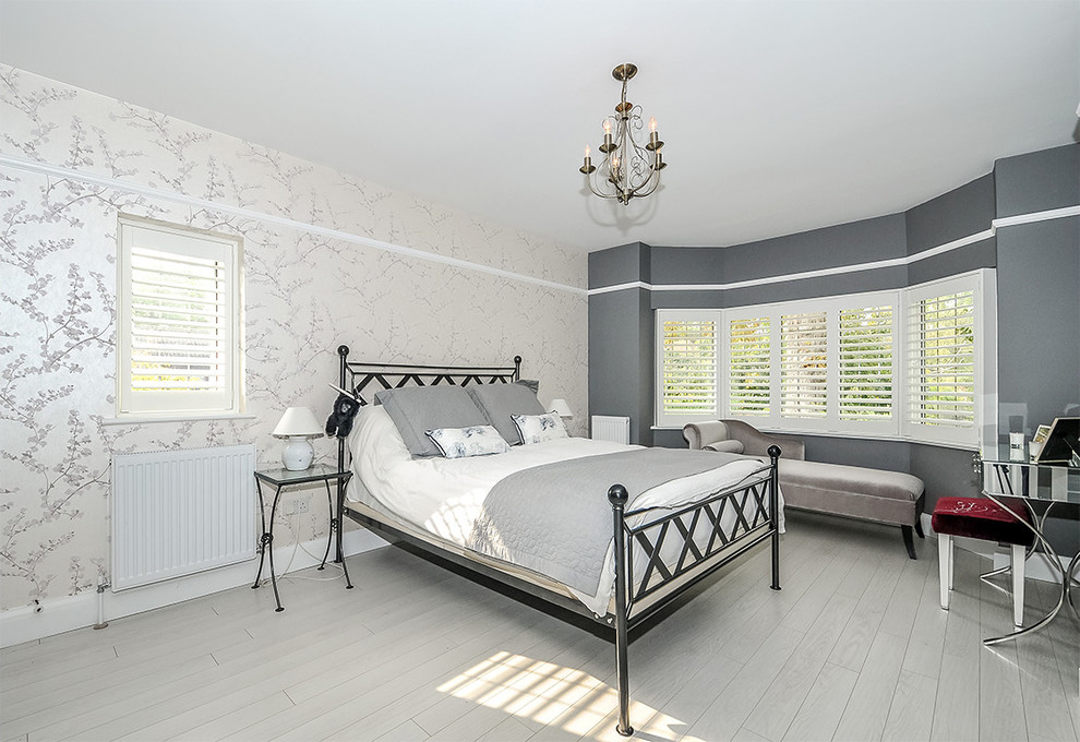 Photo of a medium sized classic guest and grey and silver bedroom in London with grey walls, painted wood flooring, no fireplace and grey floors.