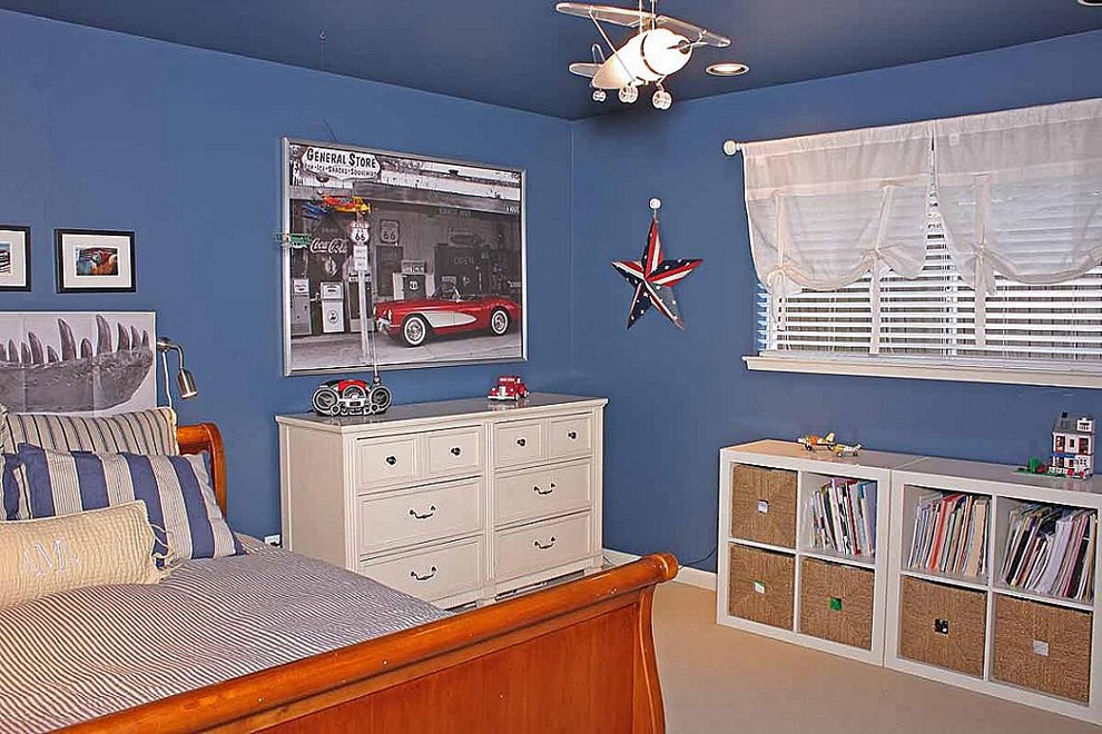 Example of a minimalist bedroom design in Houston