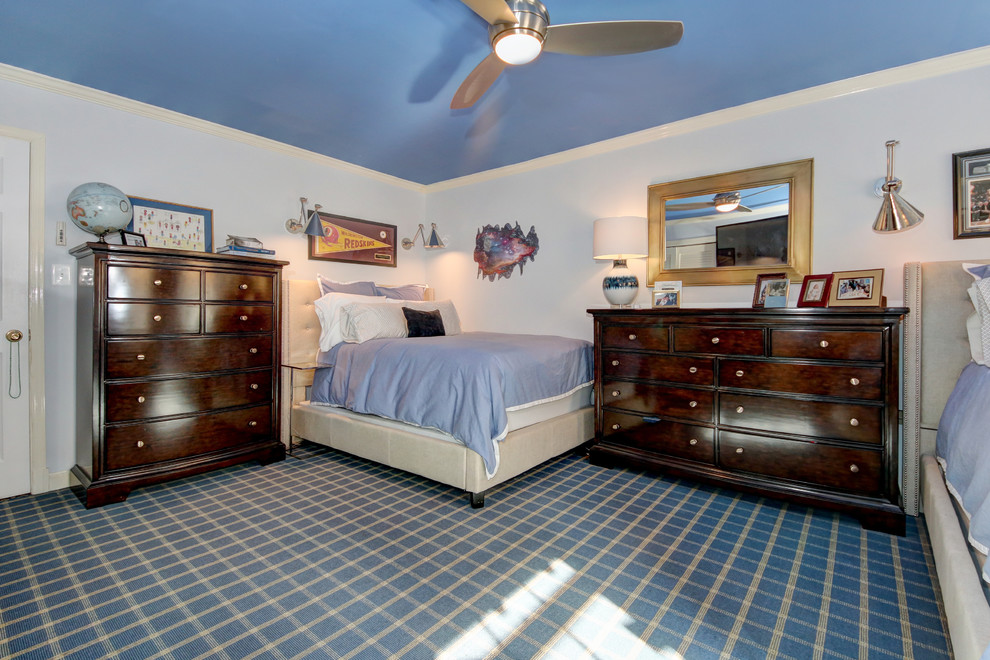 Example of a mid-sized classic guest dark wood floor and brown floor bedroom design in DC Metro with blue walls and no fireplace