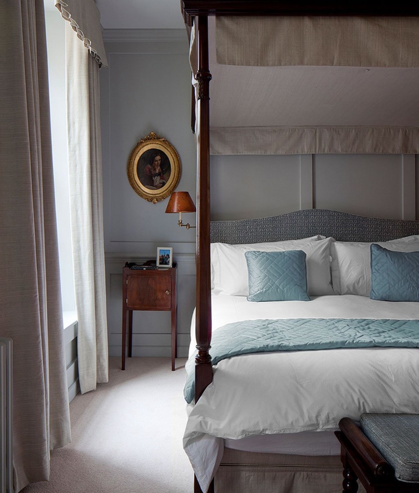 Inspiration for a classic bedroom in London with grey walls, carpet and beige floors.