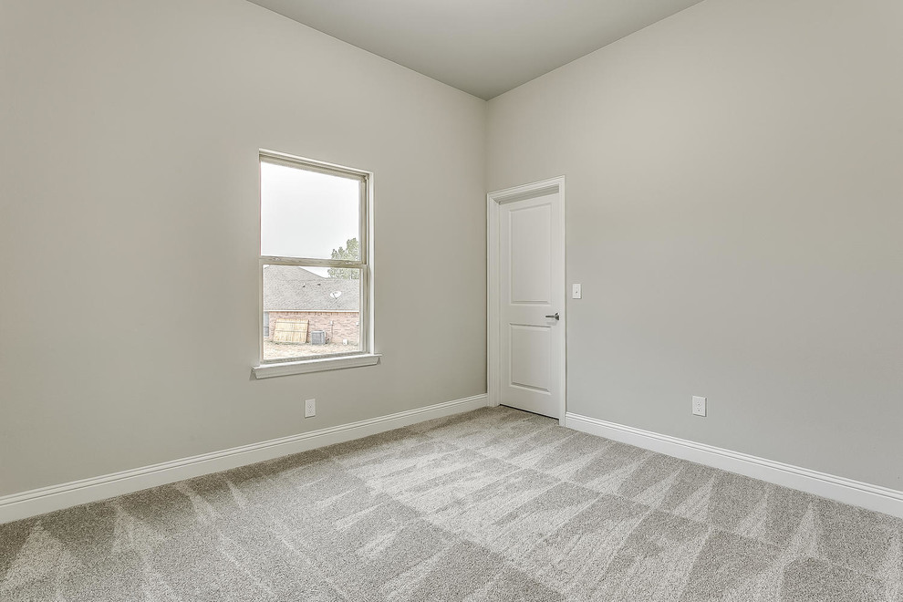 Foto di una camera degli ospiti moderna di medie dimensioni con pareti grigie, pavimento in gres porcellanato e pavimento grigio