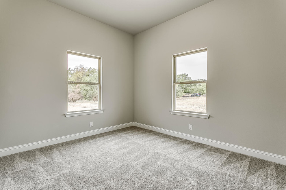 Inspiration for a medium sized modern guest bedroom in Dallas with grey walls, carpet and grey floors.