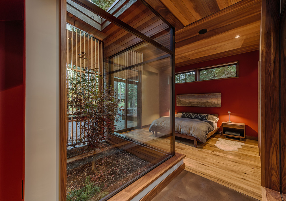 Inspiration for a contemporary master light wood floor bedroom remodel in San Francisco with red walls and no fireplace