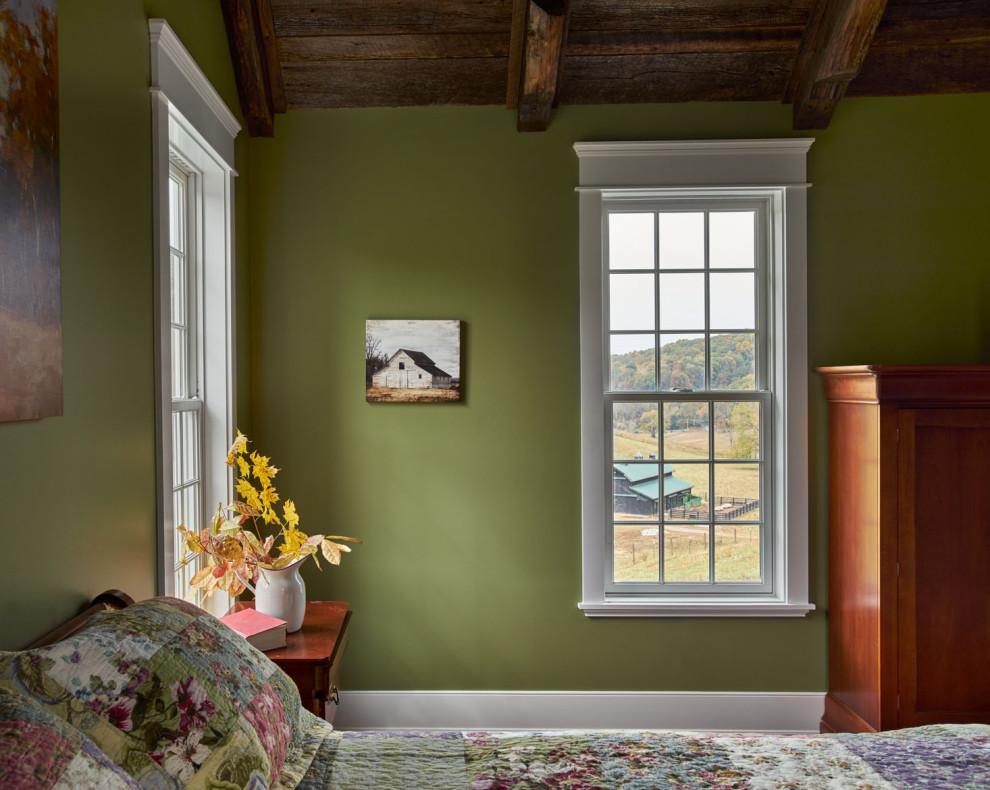 Inspiration for a mid-sized cottage medium tone wood floor bedroom remodel in Other with green walls
