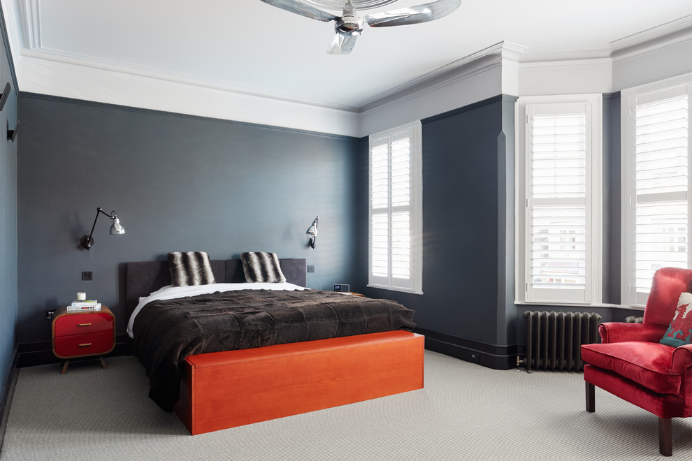 Inspiration for a contemporary master bedroom in London with grey walls and carpet.