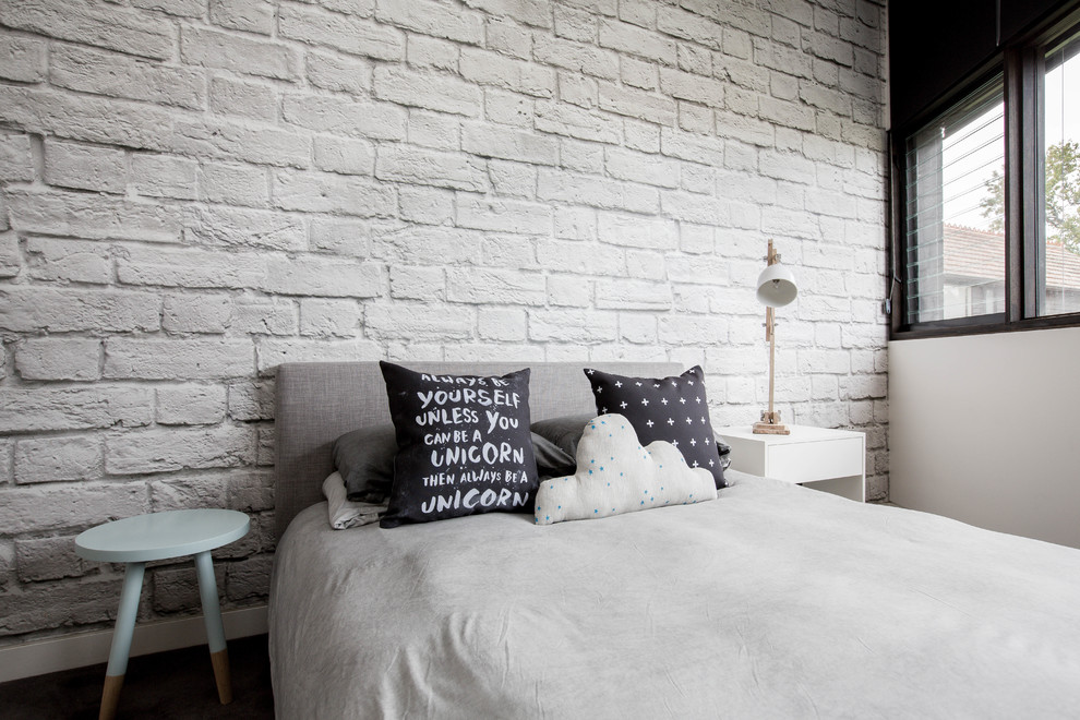 This is an example of a scandinavian bedroom in Melbourne with white walls.