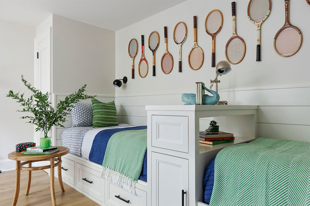 Inspiration for a beach style guest bedroom in Other with white walls, light hardwood flooring and beige floors.