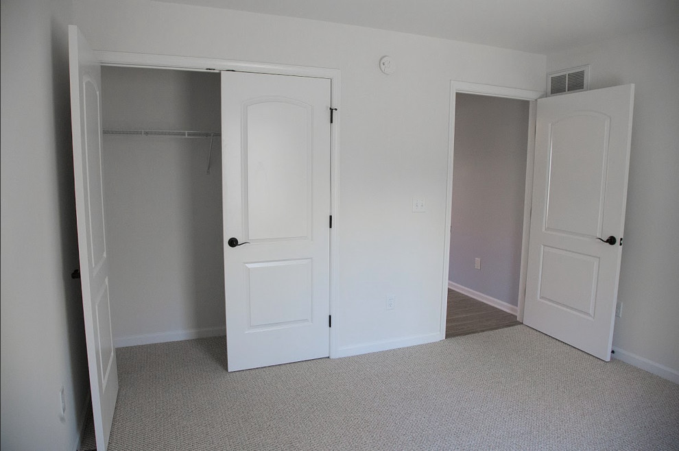 Photo of a medium sized classic guest bedroom in Philadelphia with white walls, carpet and no fireplace.
