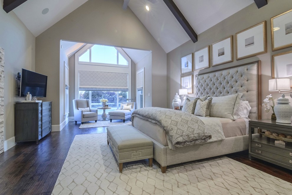 Inspiration for a large transitional master dark wood floor bedroom remodel in Dallas with gray walls, a two-sided fireplace and a stone fireplace