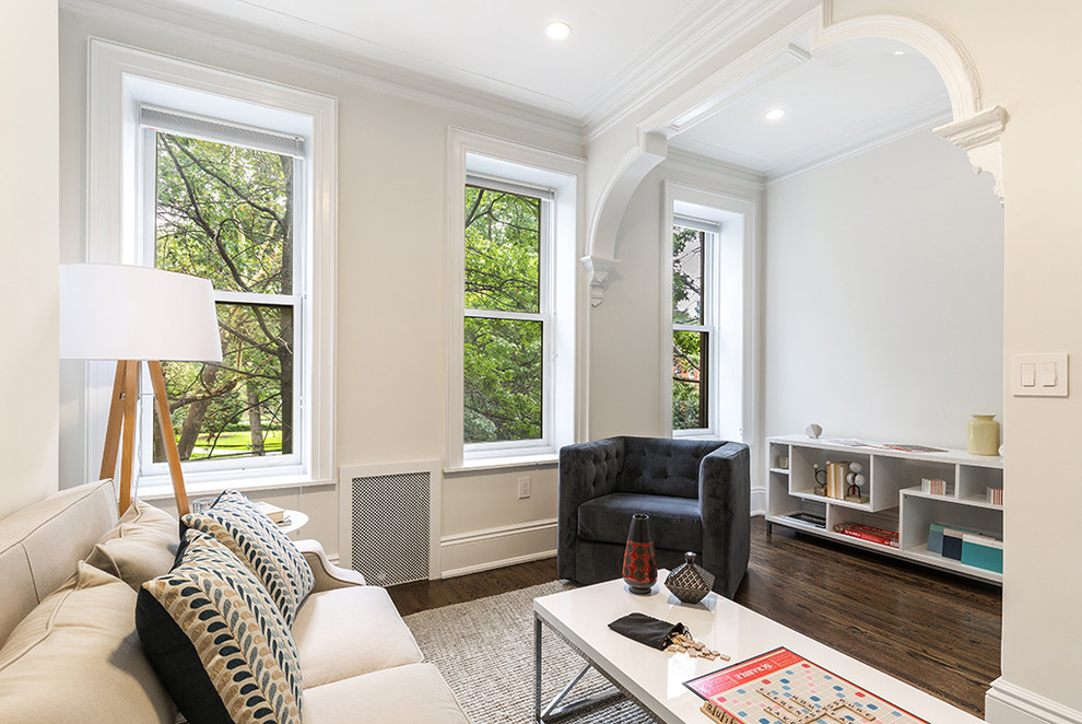 Mid-sized elegant guest dark wood floor and brown floor bedroom photo in New York with white walls and no fireplace