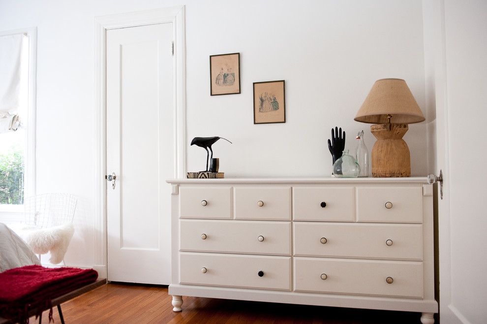 Eclectic bedroom in Dallas with white walls.