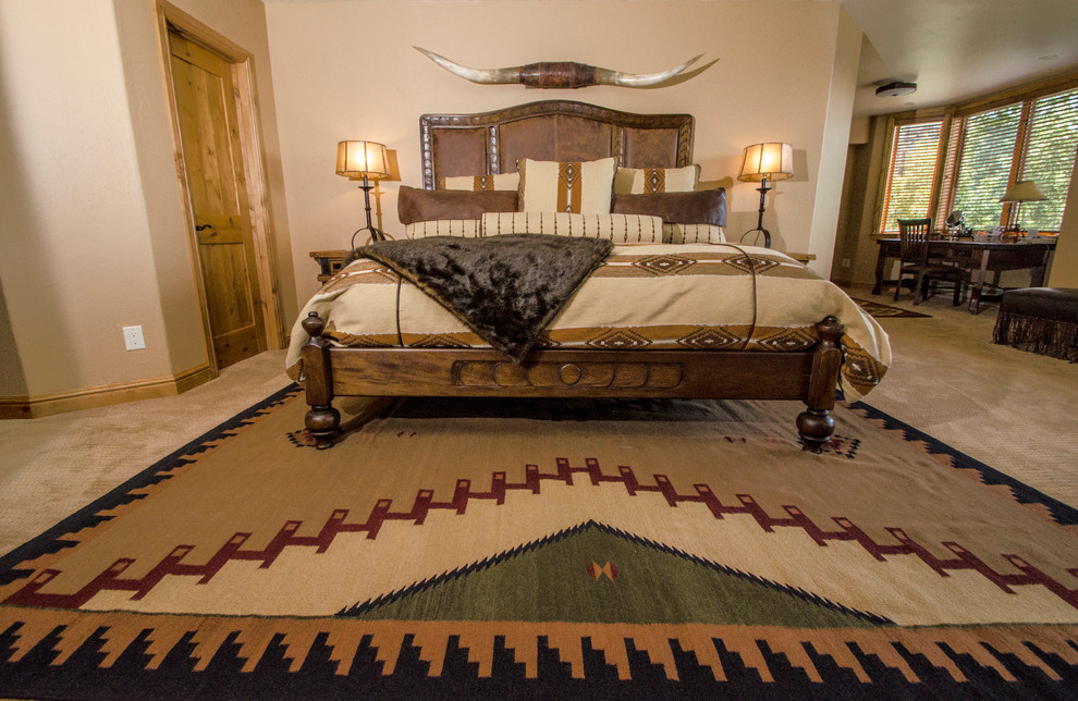 Photo of a medium sized master bedroom in Denver with beige walls and carpet.