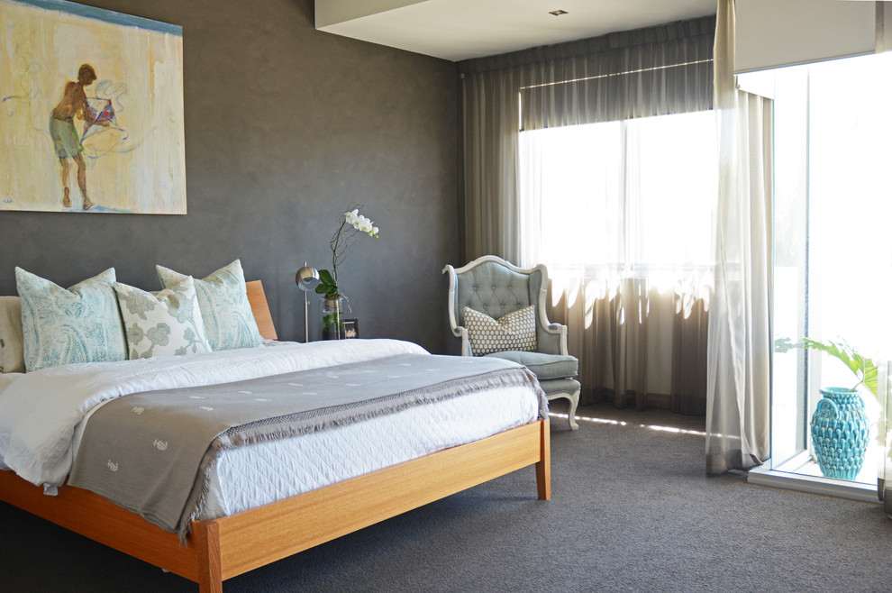 Inspiration for a contemporary bedroom in Brisbane with grey walls and carpet.