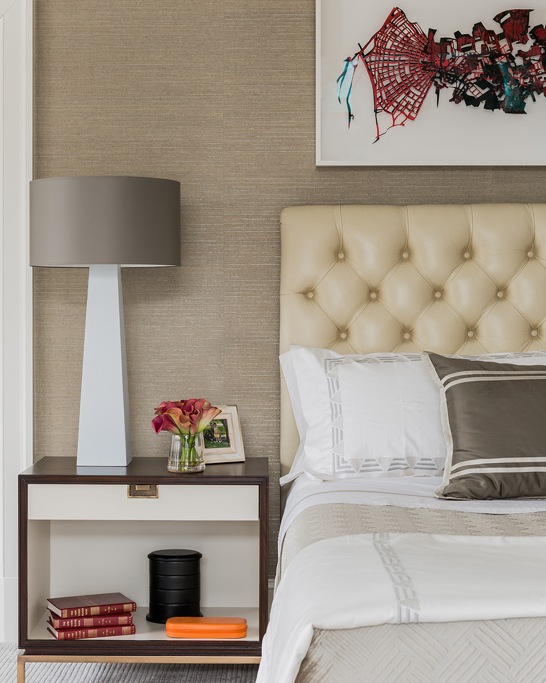 Example of a large transitional master carpeted bedroom design in Boston with brown walls