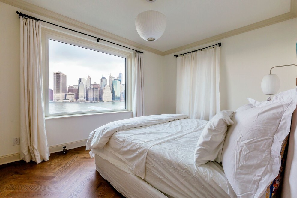 This is an example of a medium sized traditional master bedroom in New York with white walls, medium hardwood flooring, no fireplace, brown floors, a wallpapered ceiling and wallpapered walls.