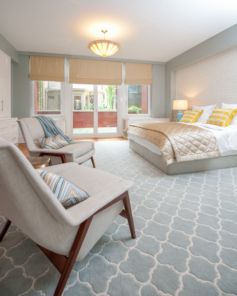 Bedroom - large transitional master medium tone wood floor bedroom idea in New York with blue walls