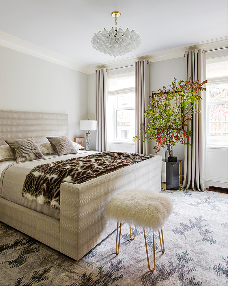 Example of a transitional master bedroom design in New York with gray walls