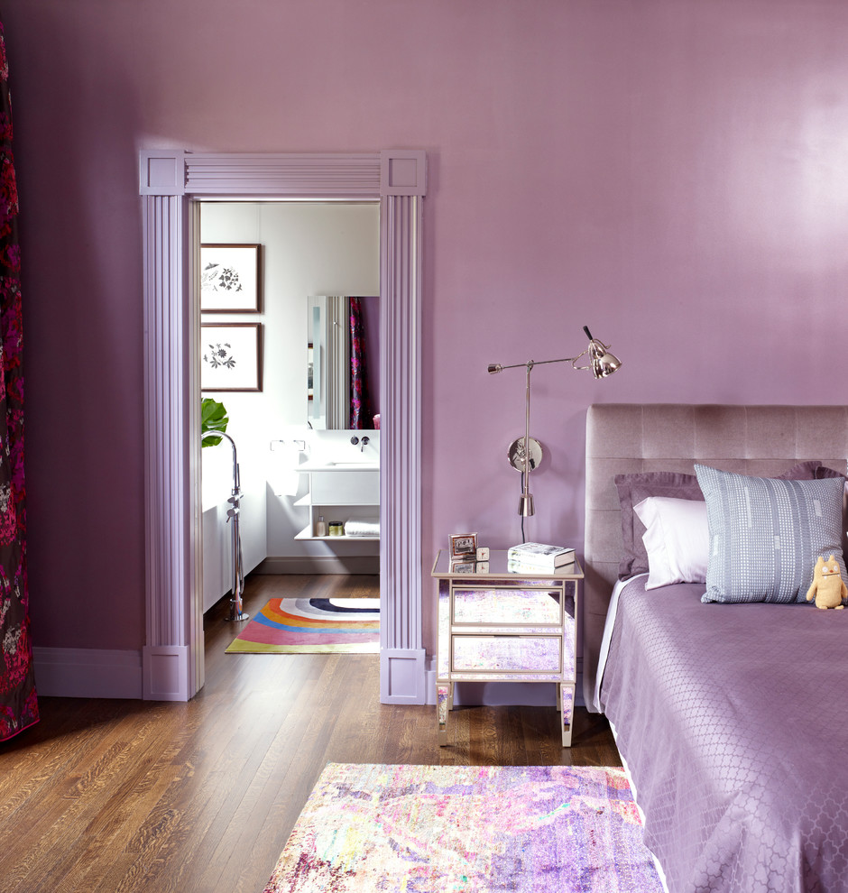 Design ideas for a contemporary grey and purple bedroom in New York with purple walls and brown floors.