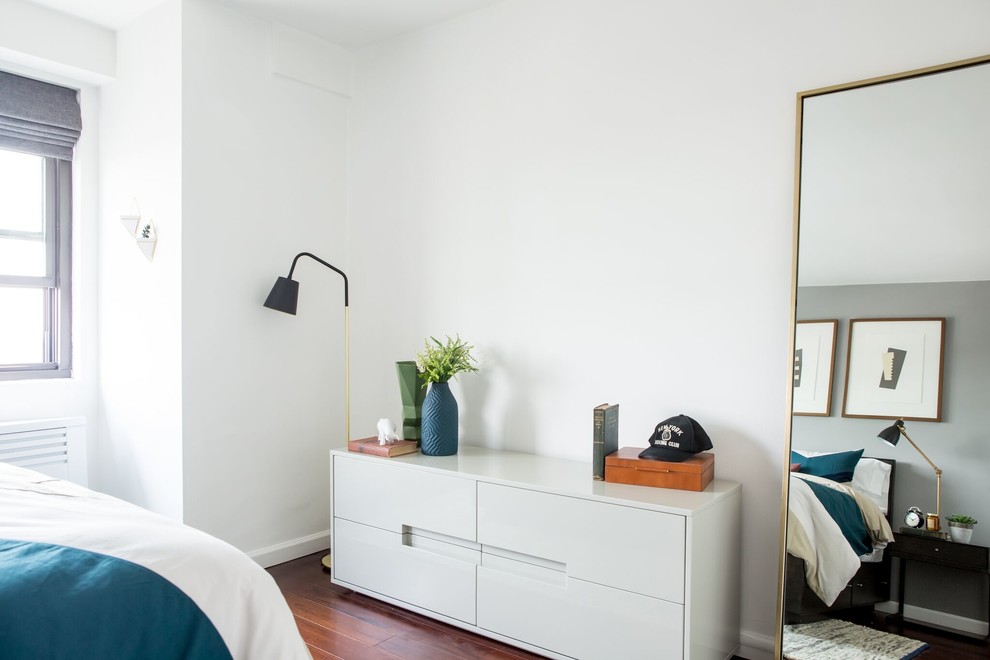 Medium sized contemporary master bedroom in New York with grey walls, dark hardwood flooring and brown floors.