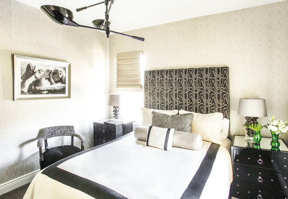 Medium sized classic cream and black bedroom in London with beige walls, carpet and black floors.